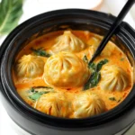 Soup Dumplings in Thai Red Curry Sauce - One Happy Bite